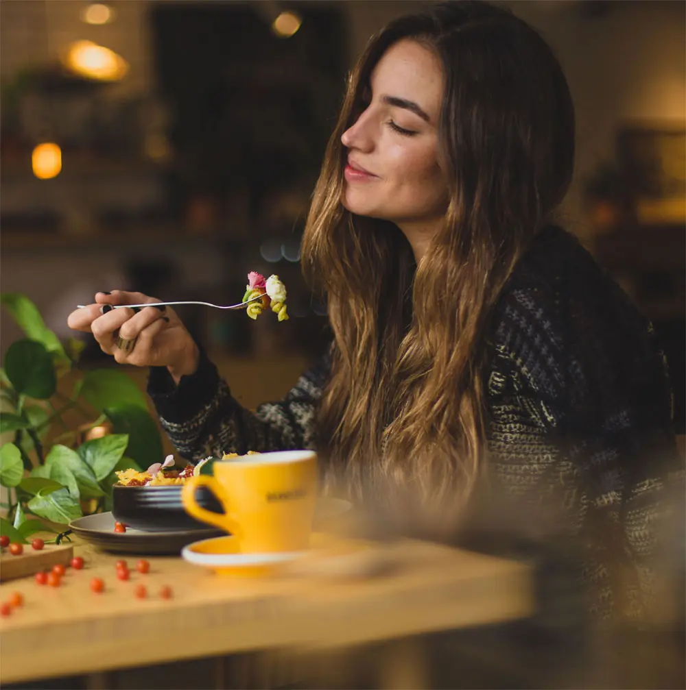 A guest enjoying breakfast by candlelight
