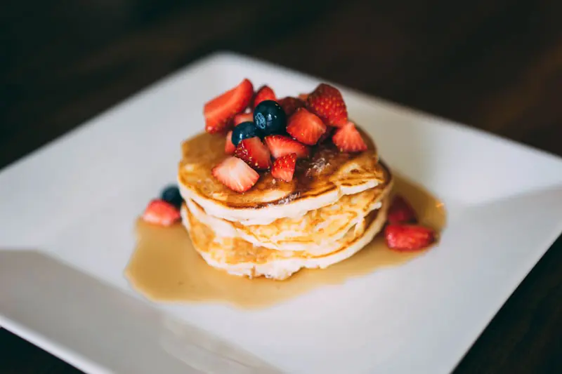 Buttermilk pancakes stacked with berries